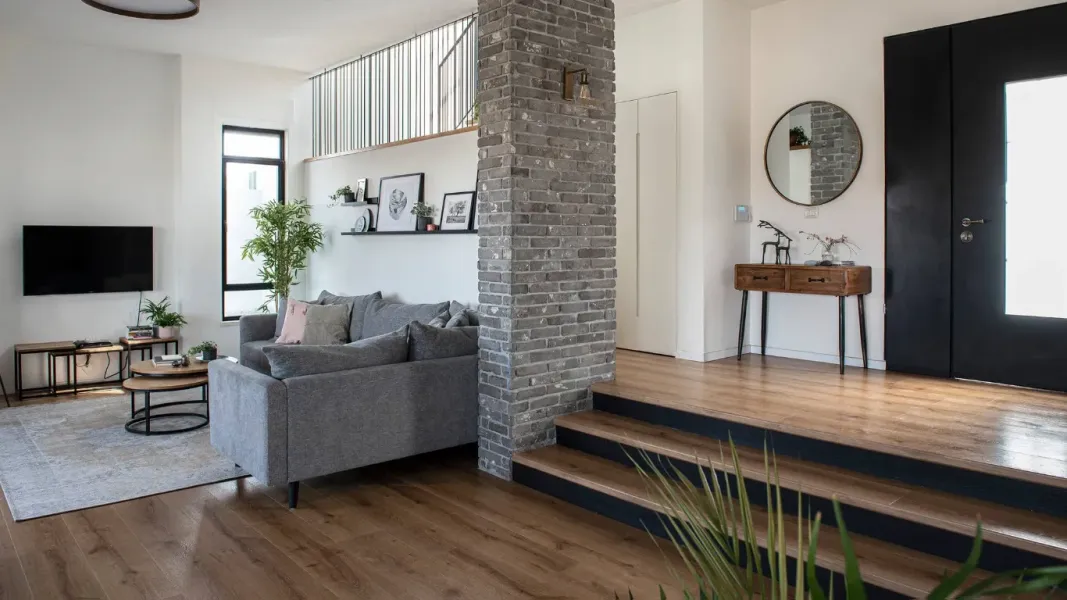 Natural spa-like bathroom with white freestanding tub and floating vanity