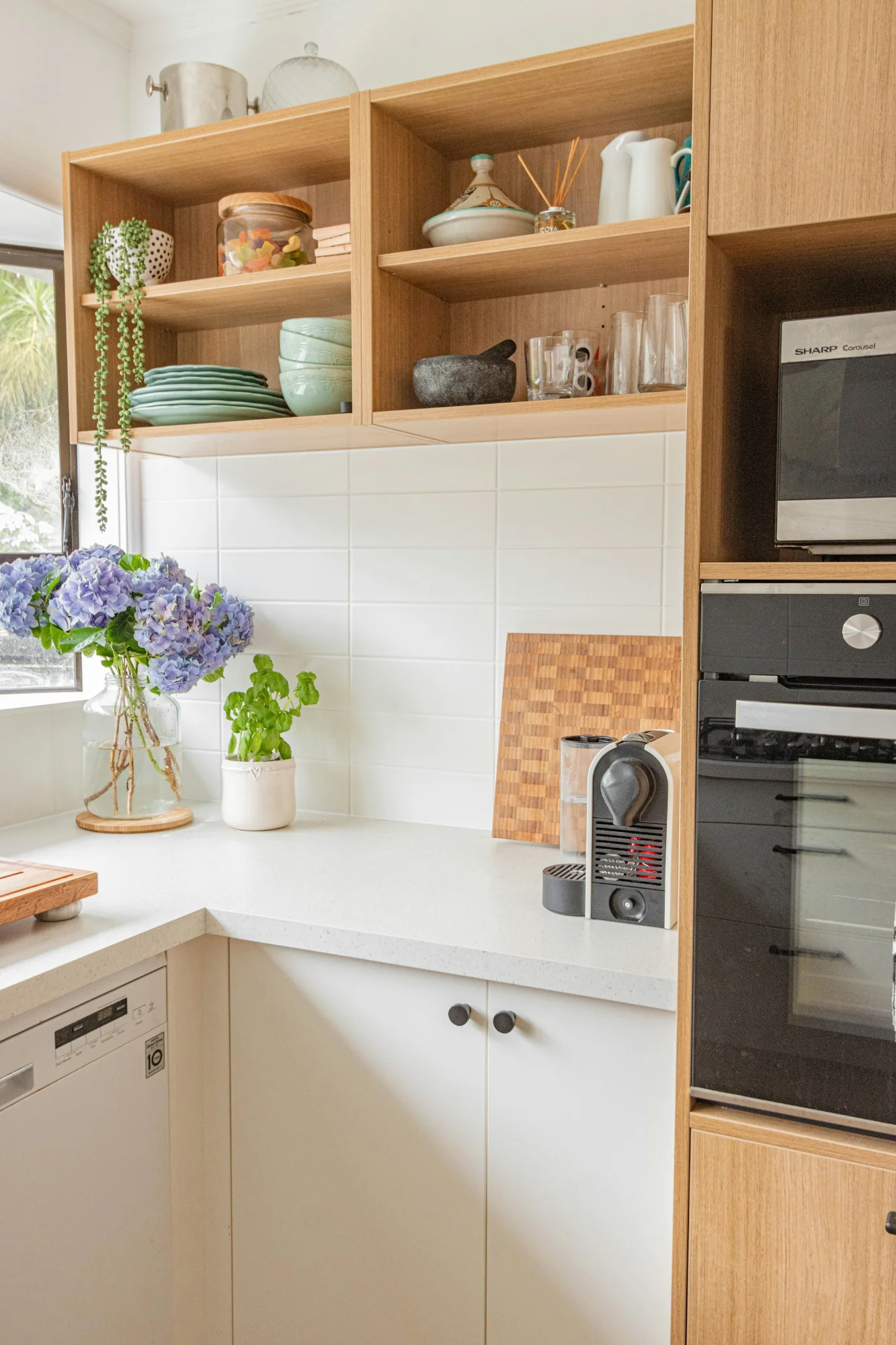 Weathered wood and white mixed cabinets with open shelves