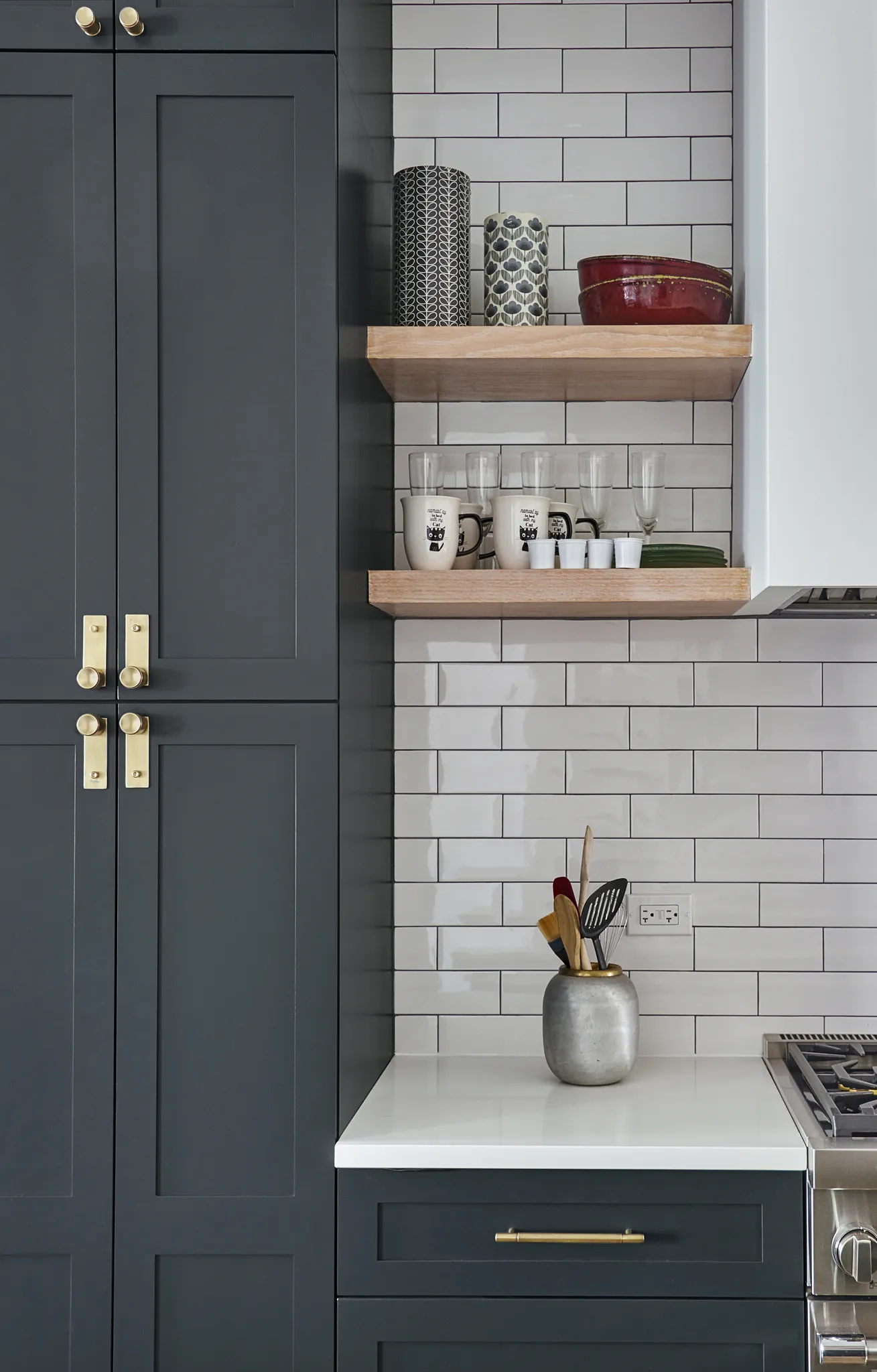 Dark gray cabinets and subway backsplash