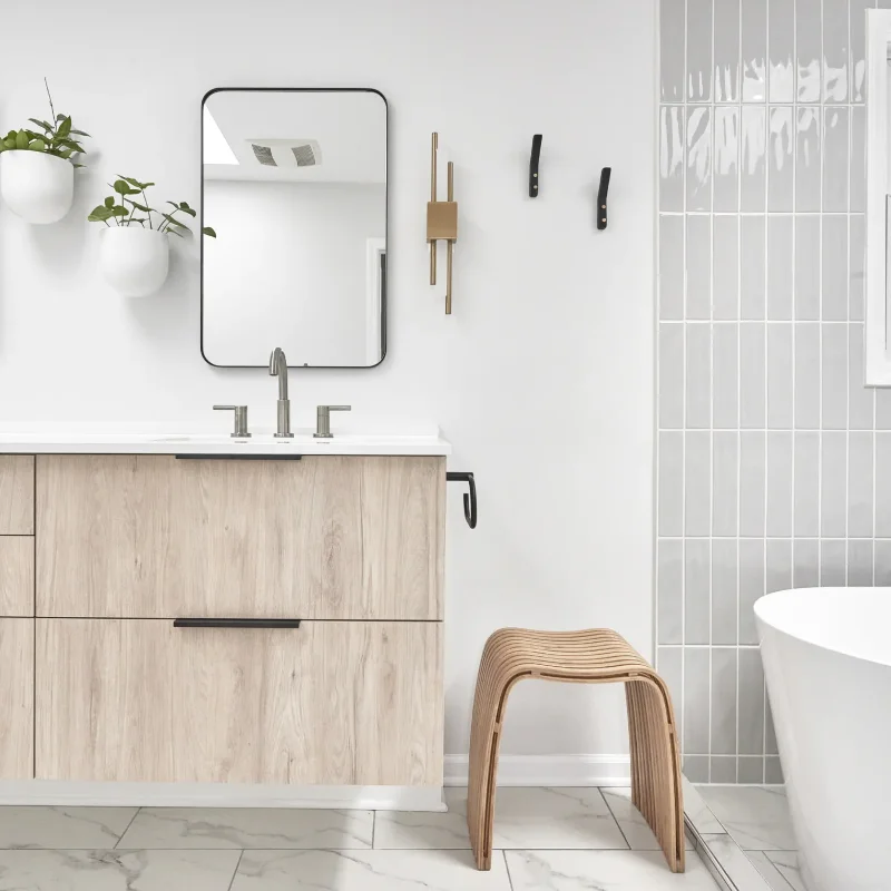 Light wood vanities in renovated bathroom